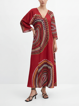 Bronze patterned Caftan worn by a person on a white background