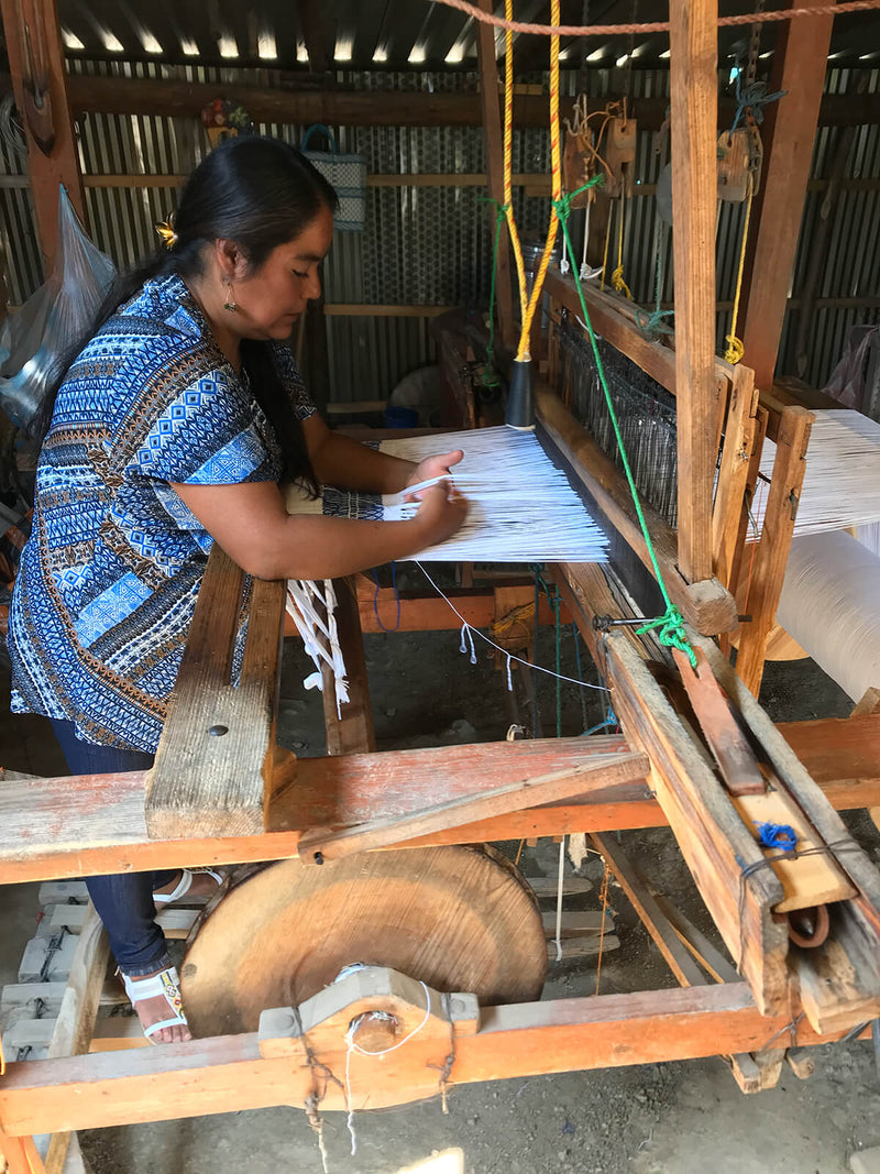 Woman working with loom