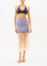 A model wearing a blue cotton macrame handloomed skirt with a denim top