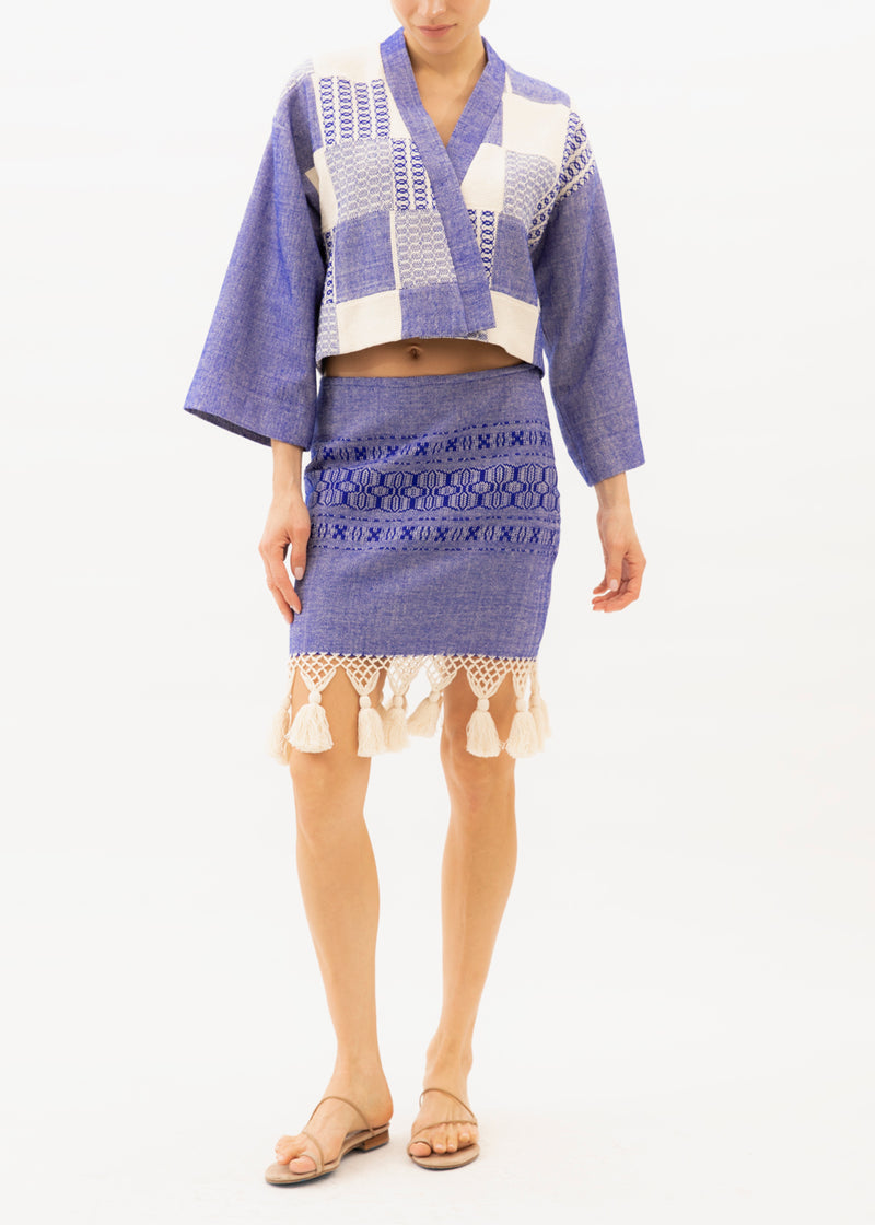 Blue skirt with ecru tassels on hemline