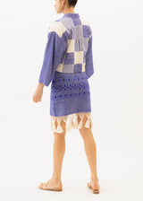 Blue skirt with ecru tassels on hemline